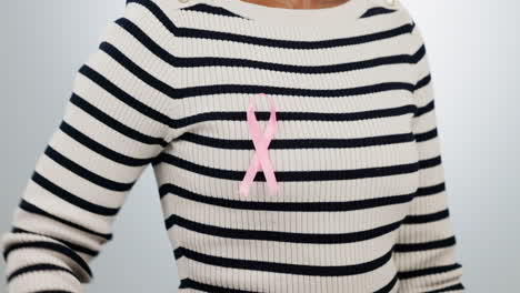 breast cancer, pink and ribbon on chest of person