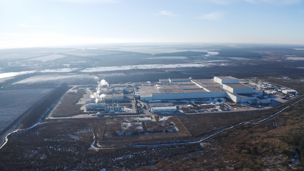 Aerial view place of industrial buildings. Aerial view of industrial zone and technology park on suburban area