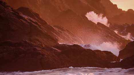 ocean waves crashing on the rocky coastline and cliffs during golden hour