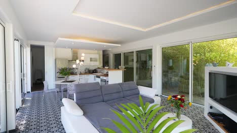 slow-rising shot showing a small modern living room with a tv in the corner