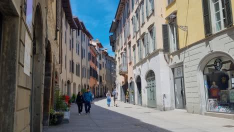 people walking on a sunny day in a charming european town