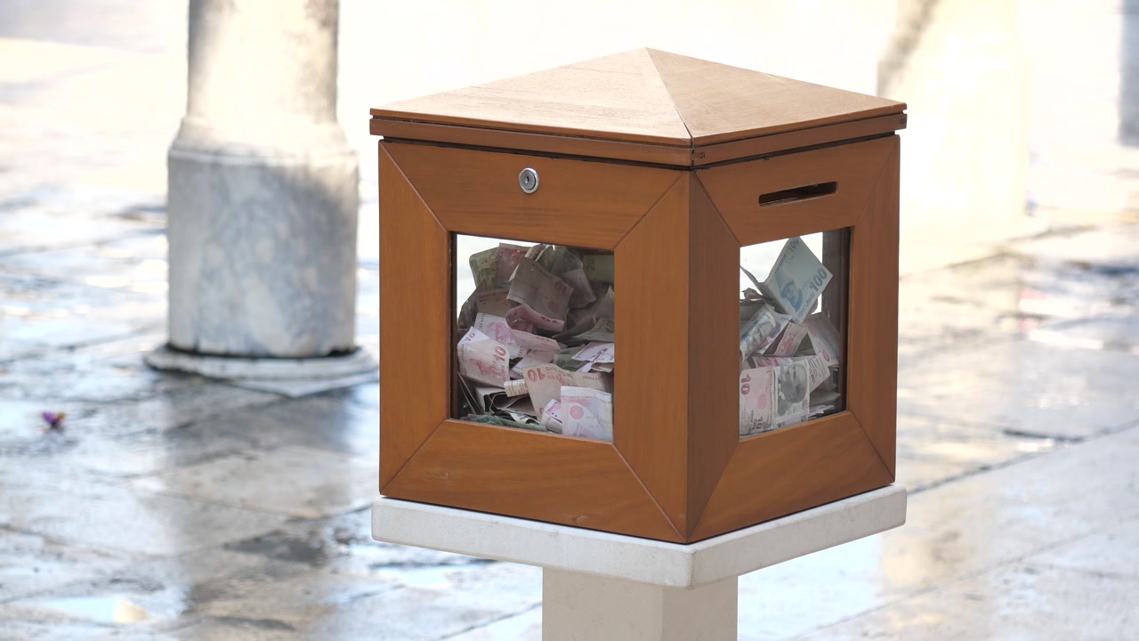 Wooden Donation Box Filled with Turkish Lira Banknotes