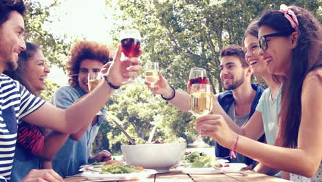 In-high-quality-format-happy-friends-in-the-park-having-lunch