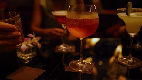 friends enjoying drinks at a bangkok bar