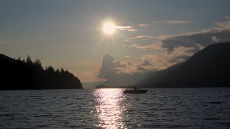 beautiful sunset on a lake with motor boat