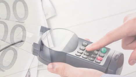 animación de billetes en euros que caen sobre la mano de un hombre caucásico que tiene una terminal de pago
