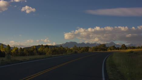 beautiful white clouds rolling over the ridgeway state park in colorado sunrise -time lapse