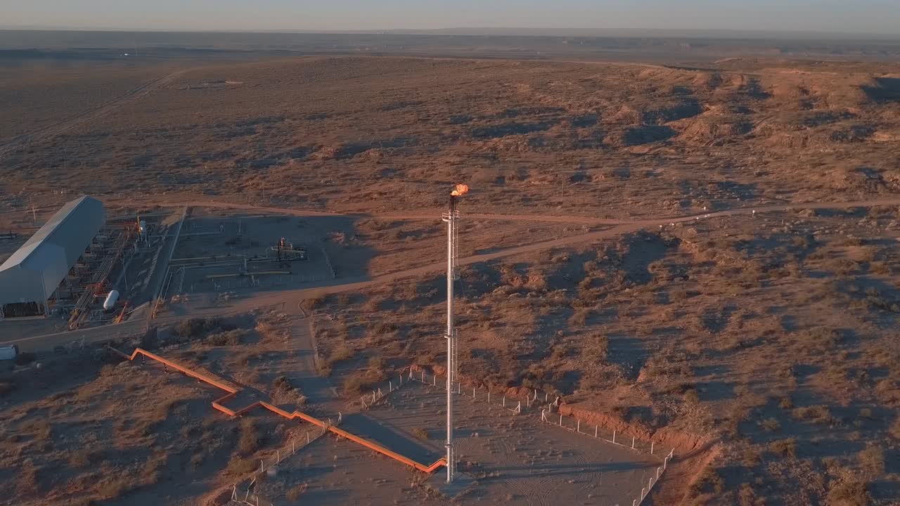 Aerial View of sunset at the pre-oil field  whit the gas flare, in the desert