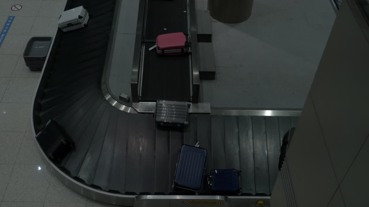 Timelapse of luggage arriving to baggage claim area