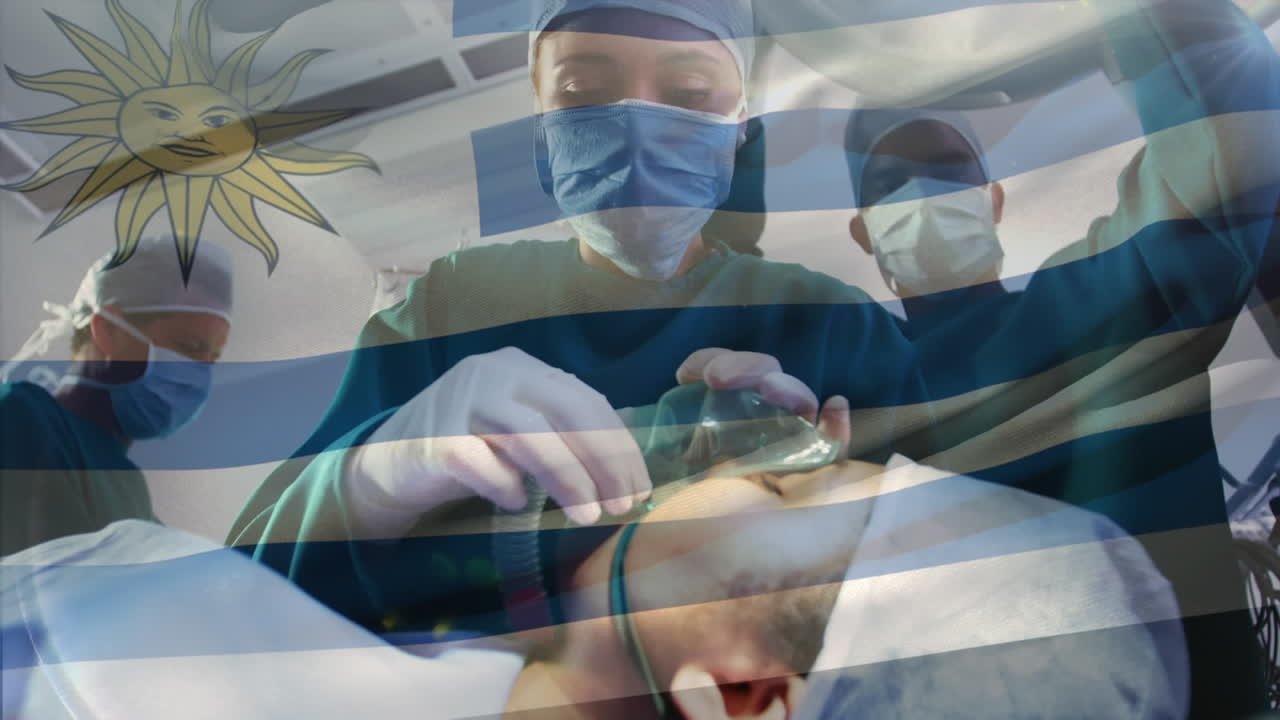 animación de la bandera de uruguay ondeando sobre los cirujanos en la sala de operaciones