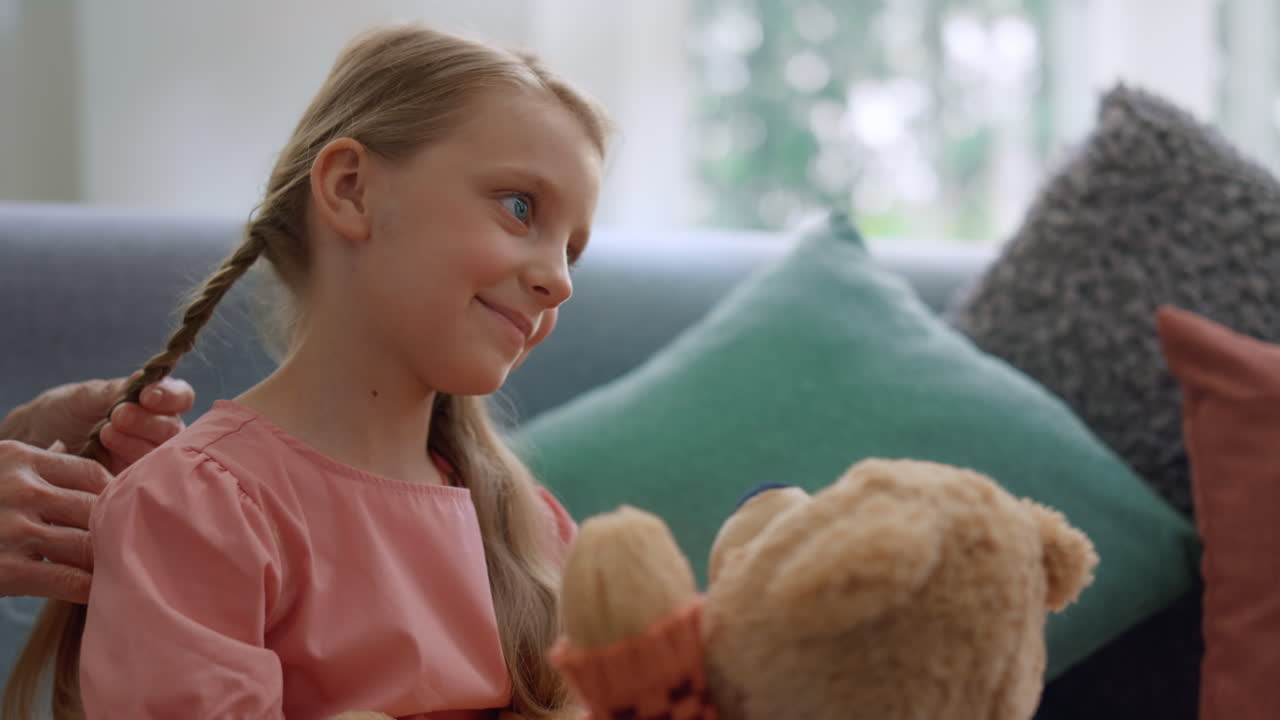 Portrait of smiling girl sitting on sofa