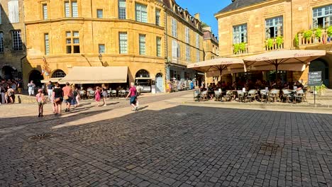 clown entertaining families in a bustling square