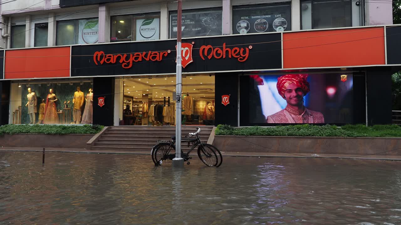 Buildings and houses are submerged in water. Rain water logged road, due to Super cyclone Amphan. The devastation has made many damages to West Bengal state.