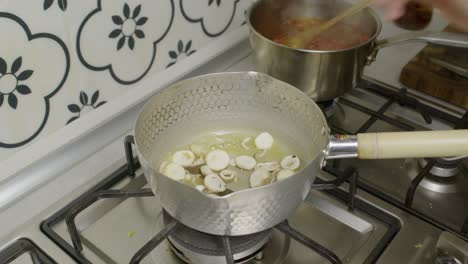 chef adds mushrooms into cooking pot with boiling butter