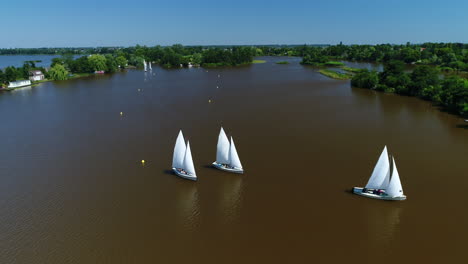 sailboats at the waterway of reeuwijkse plassen in south holland, netherlands