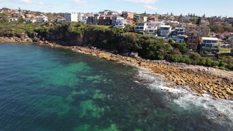 waves on rocky shore, gordons bay, sydney, nsw, australia - drone shot