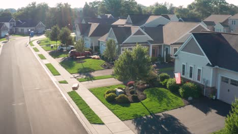 aerial view of drone delivering a box, package to home in usa