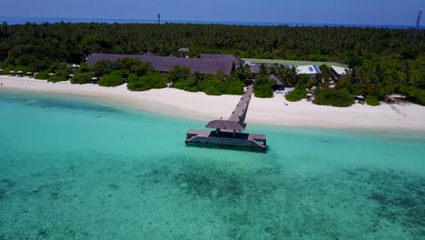 aerial pan, wooden covered jetty on maldives paradise islands, 4k