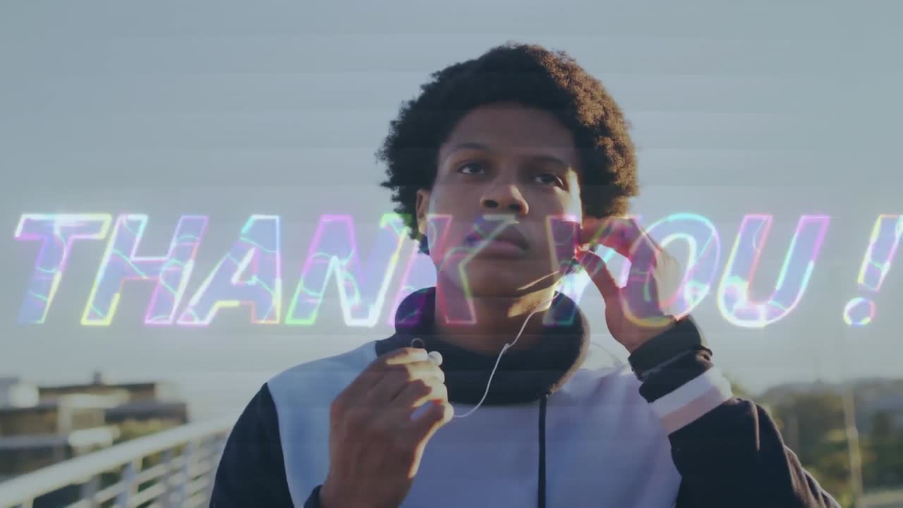 Animation of thank you text over biracial male runner wearing earphones