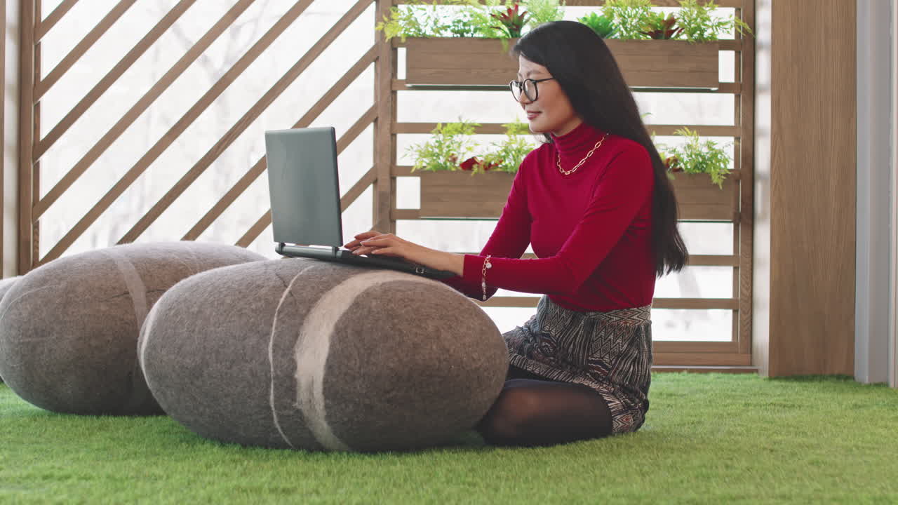 Asian Woman Working in Coworking Space