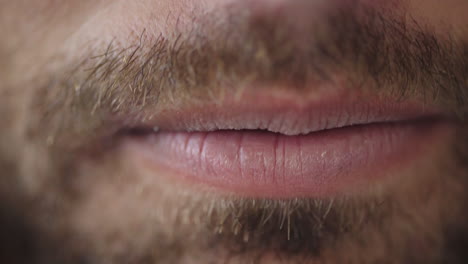 close up young man lips smiling happy sad teeth dental health facial hair beard