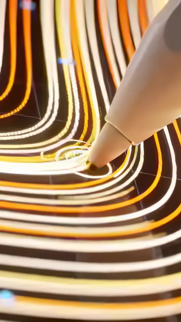 Vertical video: Pressing white stylus nib adding loops to neon bands on tablet screen, copy space