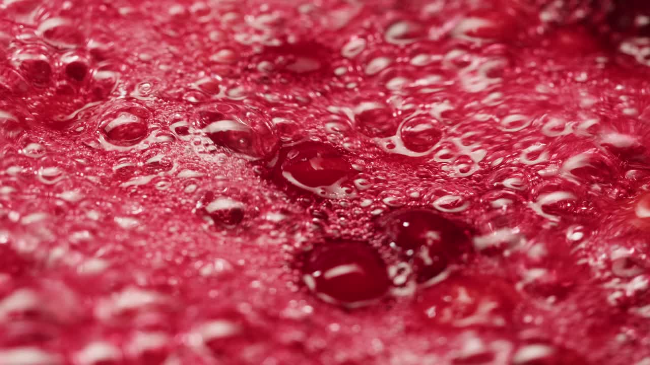 Frozen cranberries cooking for tea or jam, Background Close up of cranberry berries in on the kitchen, chef making dessert healthy pie.