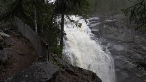 big dramatic waterfall in the forest. slowmotion