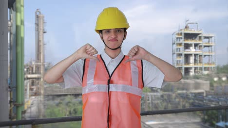 upset indian female architect showing thumbs down