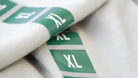 close-up of clothing labels showing size xl