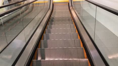 escalator pov of person riding on one