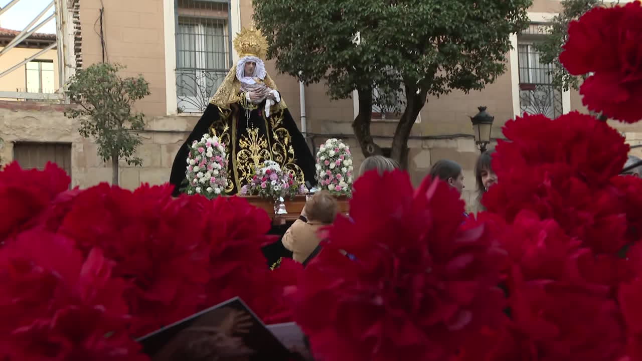 Religious Procession with Saint Statue and Carnations