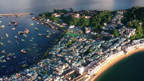 aerial view above sunny peaceful cheung chau island hong kong harbour village waterfront