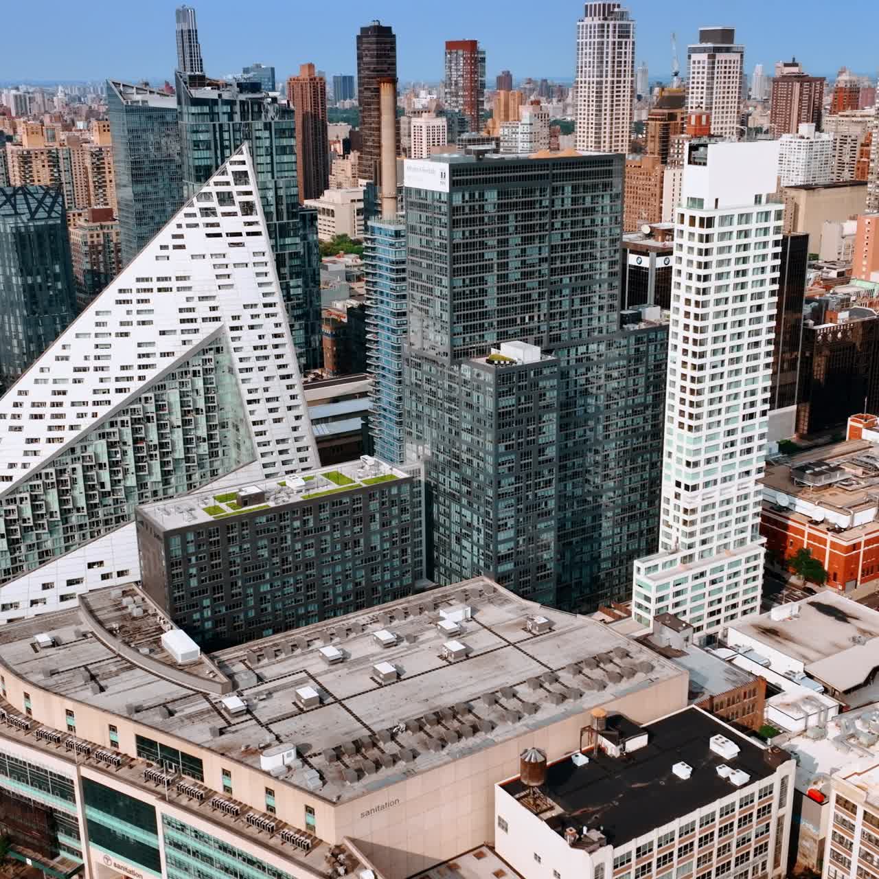 Outstanding multistoried buildings of unusual design. New York scenery on bright sunny day. Top view