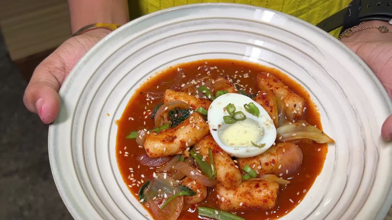 Tukboki, a south Korean dish with egg served in a restaurant in Kolkata