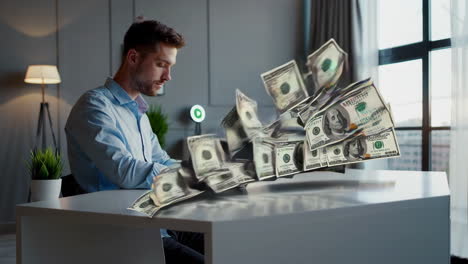 man working at a desk with money flying around