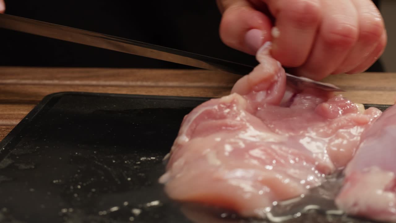 Cutting raw chicken
