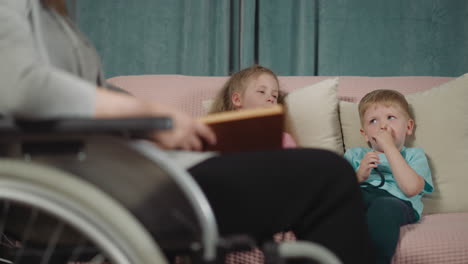 preschooler and toddler listen to mother reading fairytale