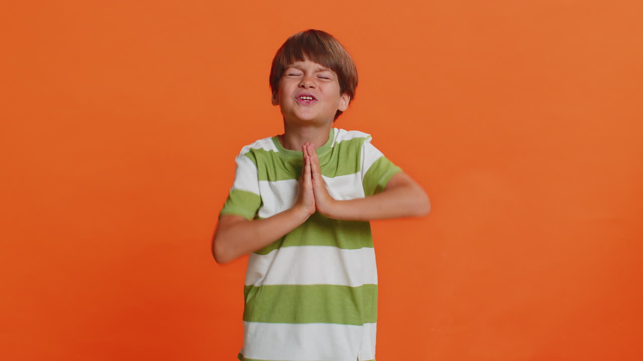 Preteen child boy praying making wish asking hopeful help begging apology imploring forgiveness