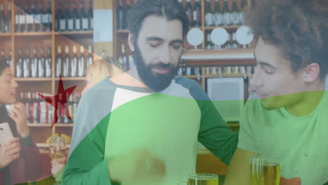 at bar, two men talking with djibouti flag animation overlaying scene