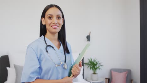 Animation-of-happy-biracial-female-doctor-looking-at-camera