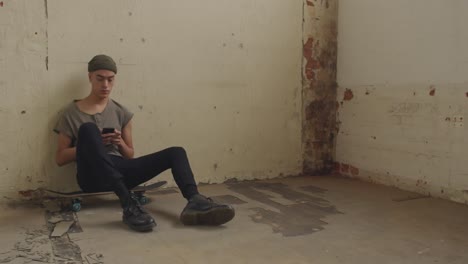 Fashionable-young-man-in-an-abandoned-warehouse