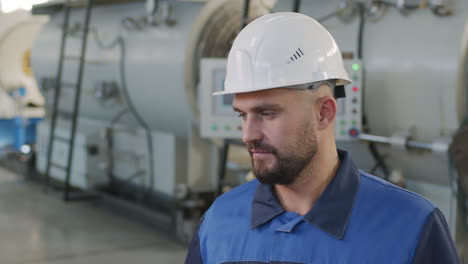 plant worker with roll of hdpe pipes