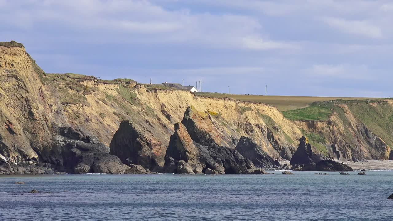 Ireland Epic Locations dramatic Black Sea stacks and golden cliffs Copper Coast Waterford in spring