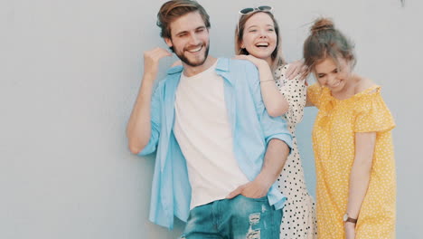 three friends posing outdoors