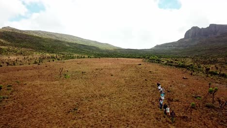 aerial view of hikers walking on the trail, climbing mount elgon in kenya - drone shot