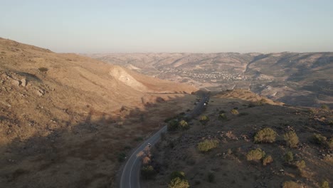 Experience-Golan-Heights-in-summer,-car-driving-on-desolate-road