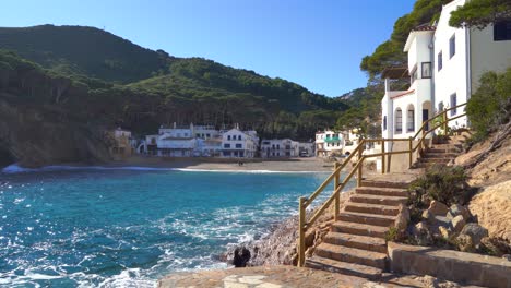 European-Beach-In-Mediterranean-Spain-White-Houses-Calm-Sea-Turquoise-Blue-Begur-Costa-Brava-Ibiza-Sa-Tuna-Aiguablava