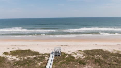 push in over beach to waves crashing onto the beach from the ocean in ponte vedra florida