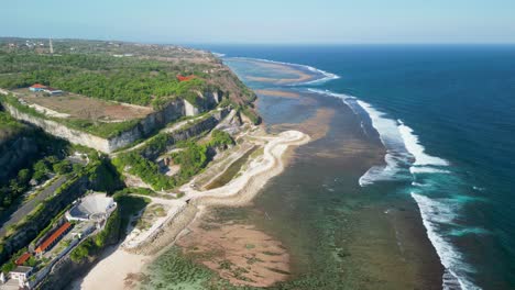 aerial over bali melasti ungasan beach, a hidden gem nestled along the southern coast of bali, indonesia